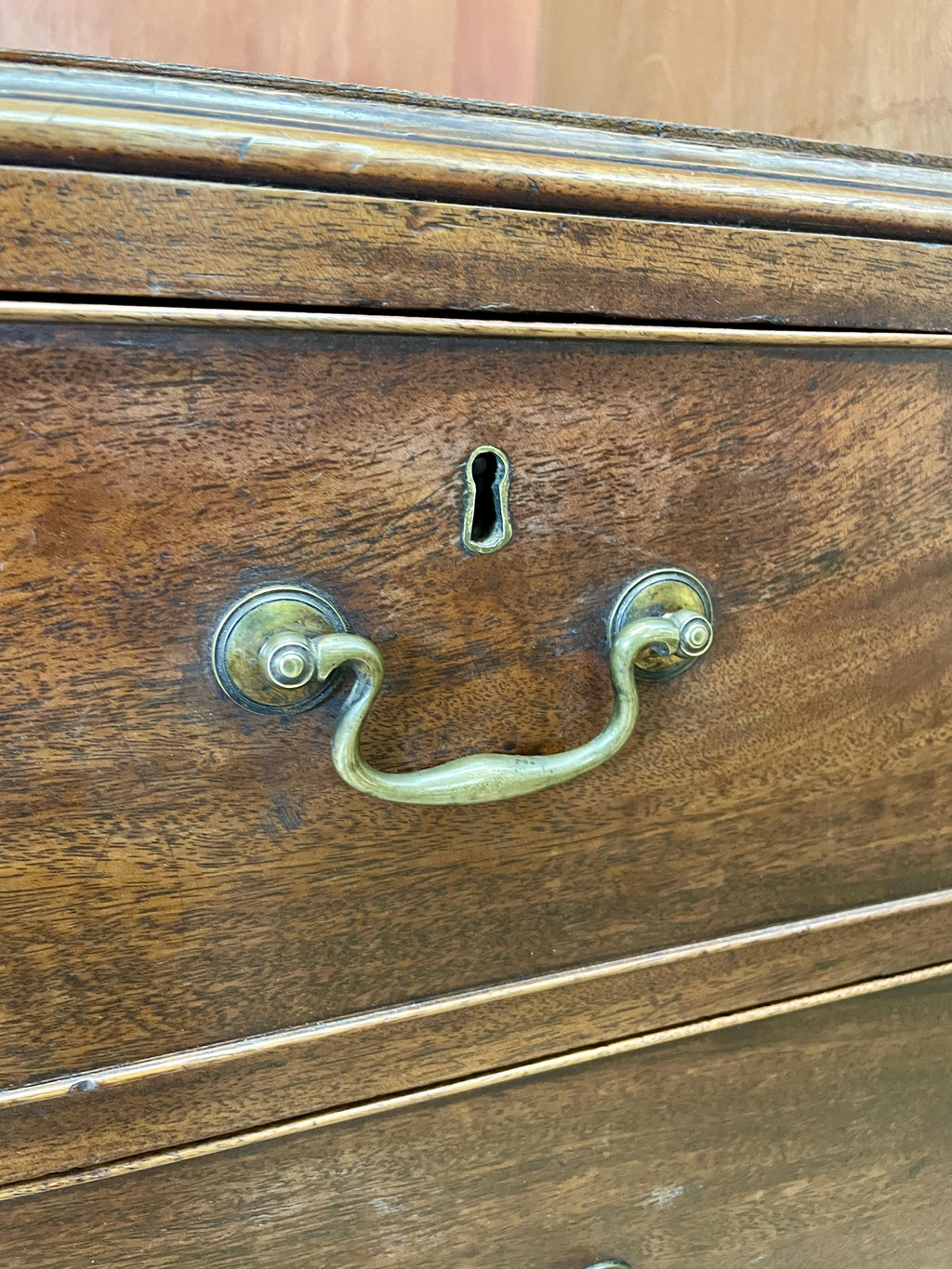 Antique Georgian mahogany tall slim wardrobe with drawers and oval panel doors on ogee bracket feet