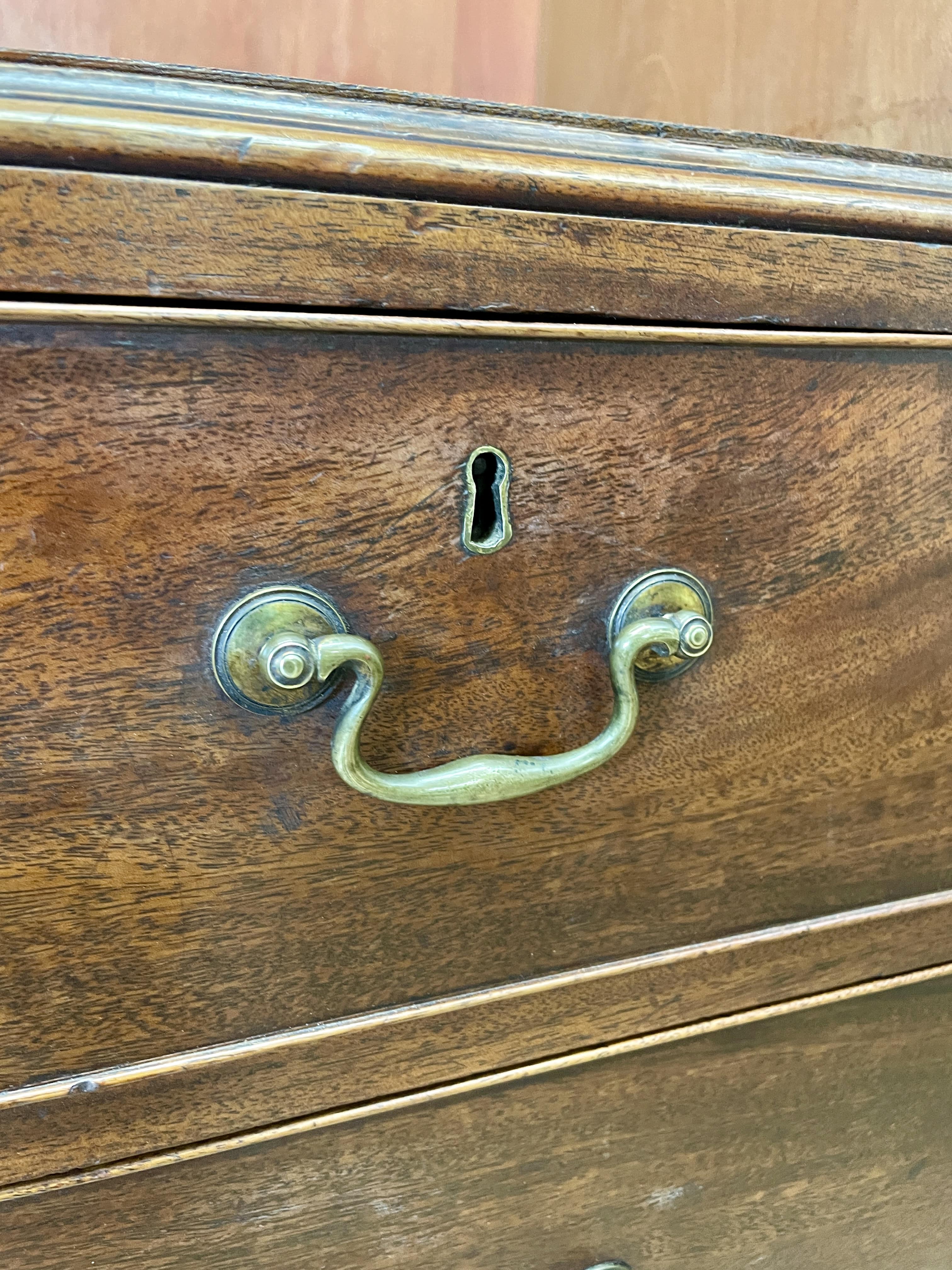 Antique Georgian mahogany tall slim wardrobe with drawers and oval panel doors on ogee bracket feet