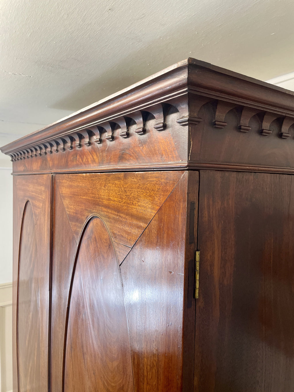 Antique Georgian mahogany tall slim wardrobe with drawers and oval panel doors on ogee bracket feet