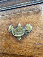 Mid-18th century antique Georgian oak chest of drawers with caddy moulded top, two short and three long graduated drawers, original brass handles, and bracket feet.