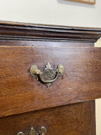 Mid-18th century antique Georgian oak chest of drawers with caddy moulded top, two short and three long graduated drawers, original brass handles, and bracket feet.