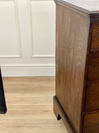 Mid-18th century antique Georgian oak chest of drawers with caddy moulded top, two short and three long graduated drawers, original brass handles, and bracket feet.