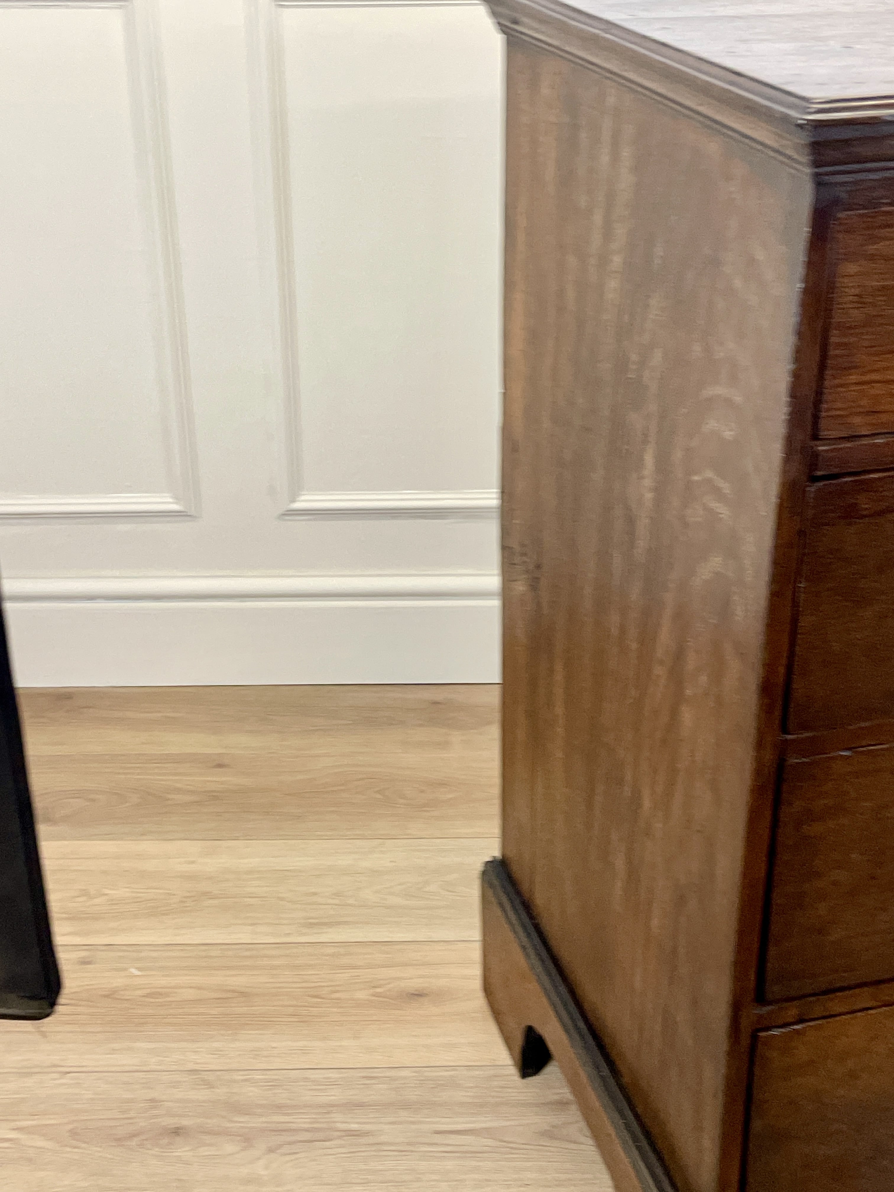 Mid-18th century antique Georgian oak chest of drawers with caddy moulded top, two short and three long graduated drawers, original brass handles, and bracket feet.