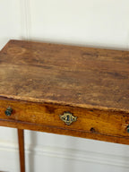 Wooden table with a decorative knob on a white background