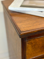 Close-up of a wooden surface with a marble slab on top