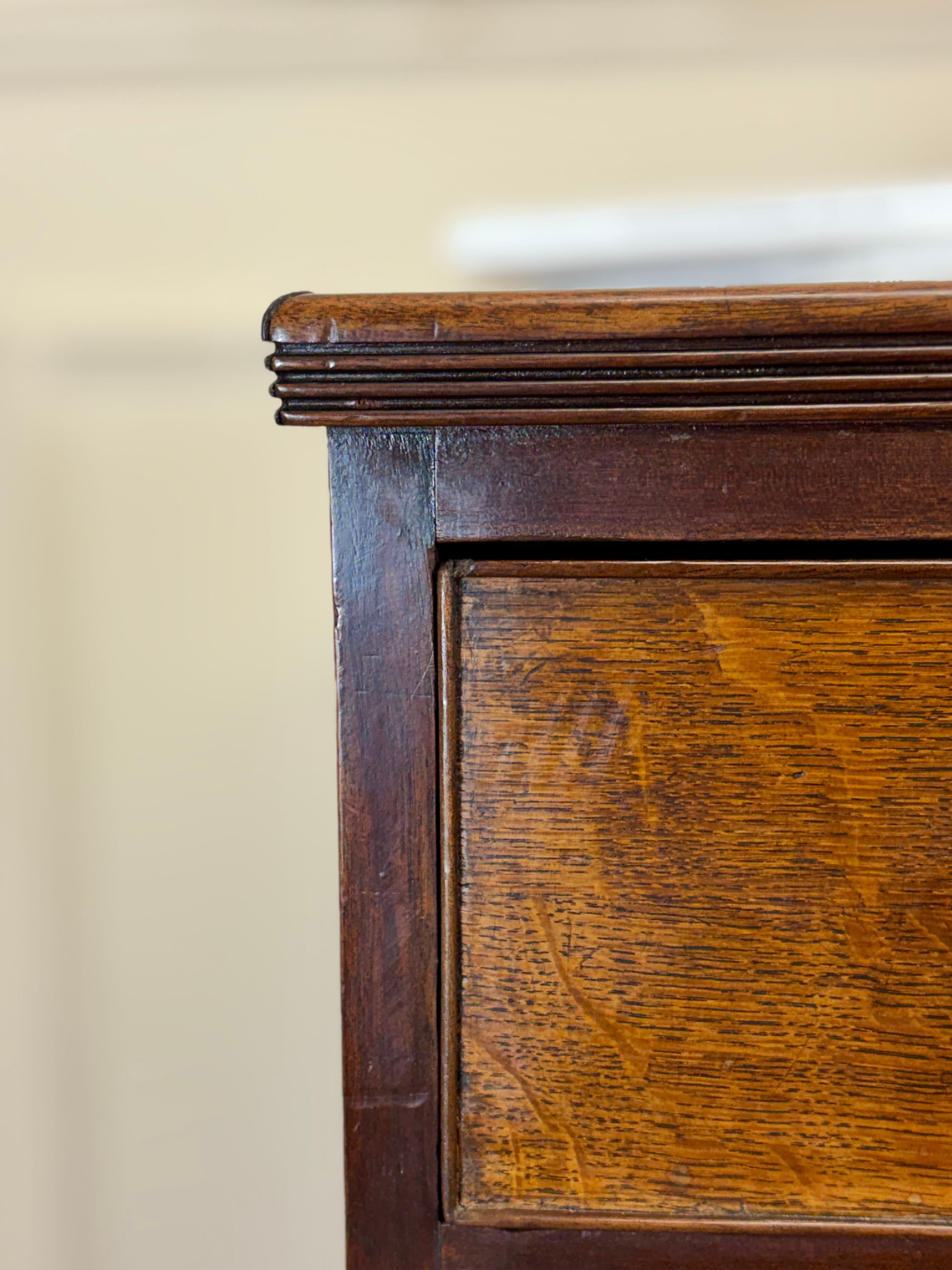 Close-up of a wooden cabinet corner with a blurred background