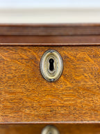 Close-up of a wooden drawer with a keyhole