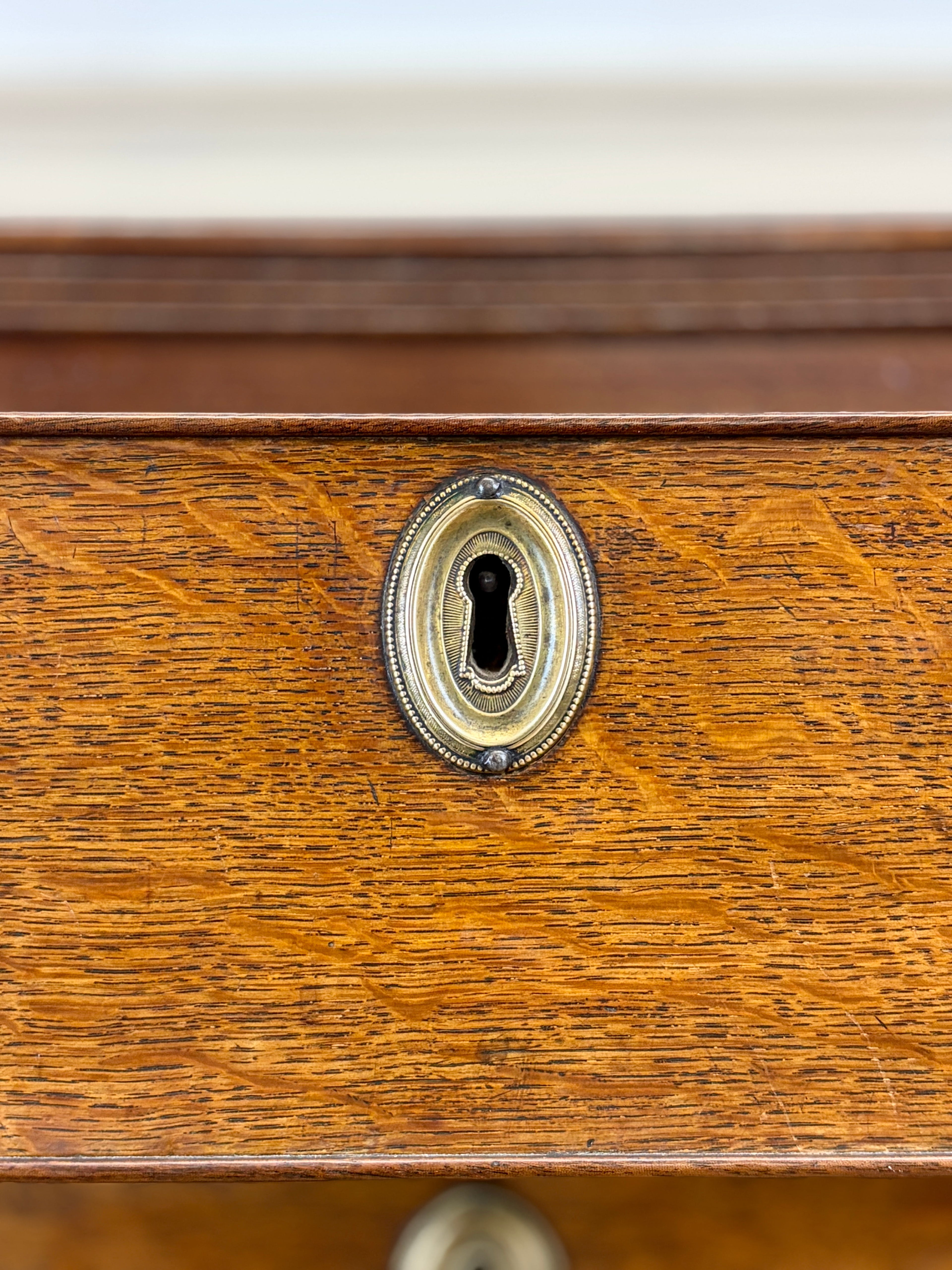 Close-up of a wooden drawer with a keyhole