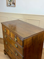 Antique light oak farmhouse chest of drawers with brass handles and patina