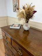 Antique light oak farmhouse chest of drawers with brass handles and patina