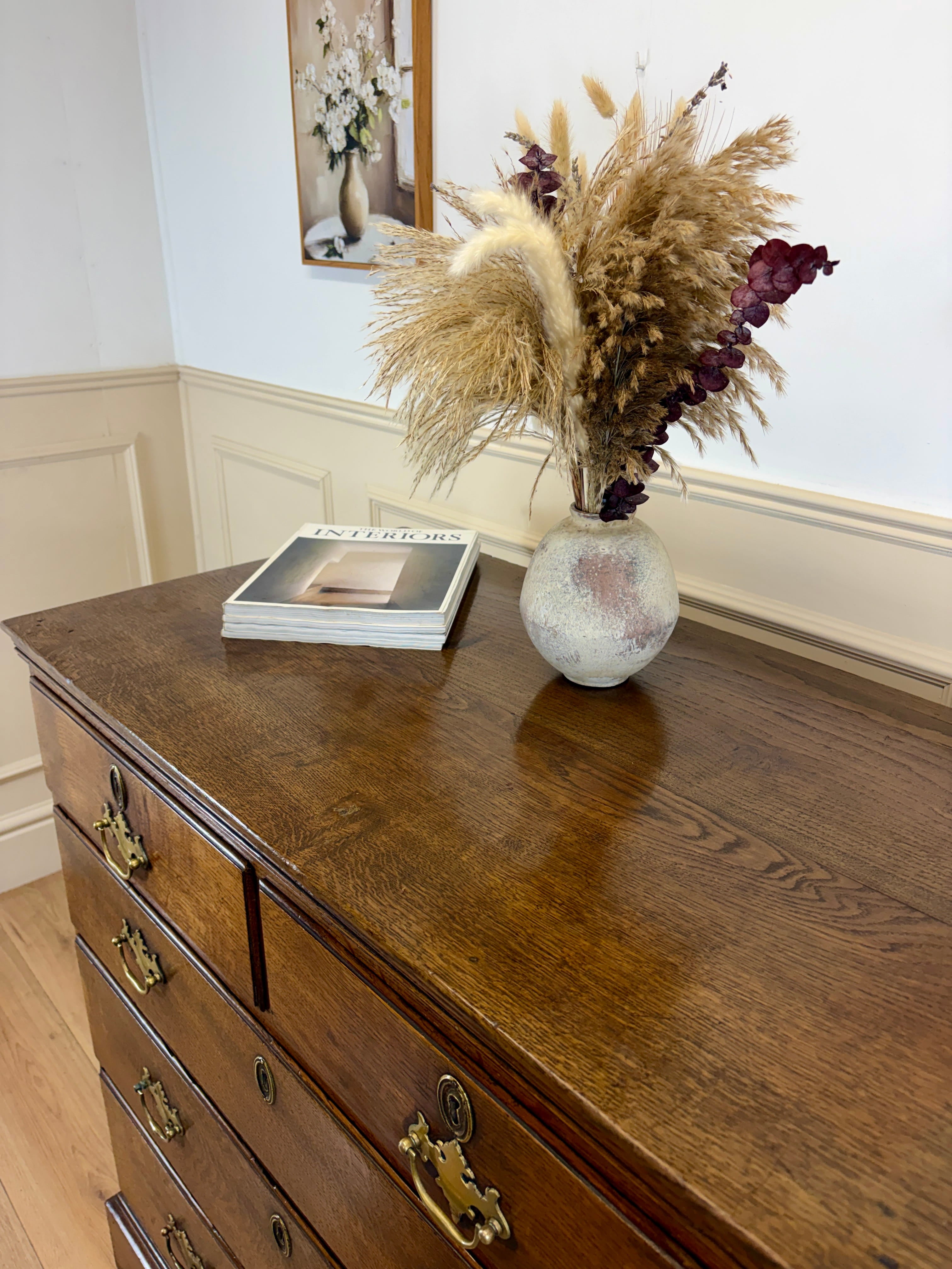 Antique light oak farmhouse chest of drawers with brass handles and patina