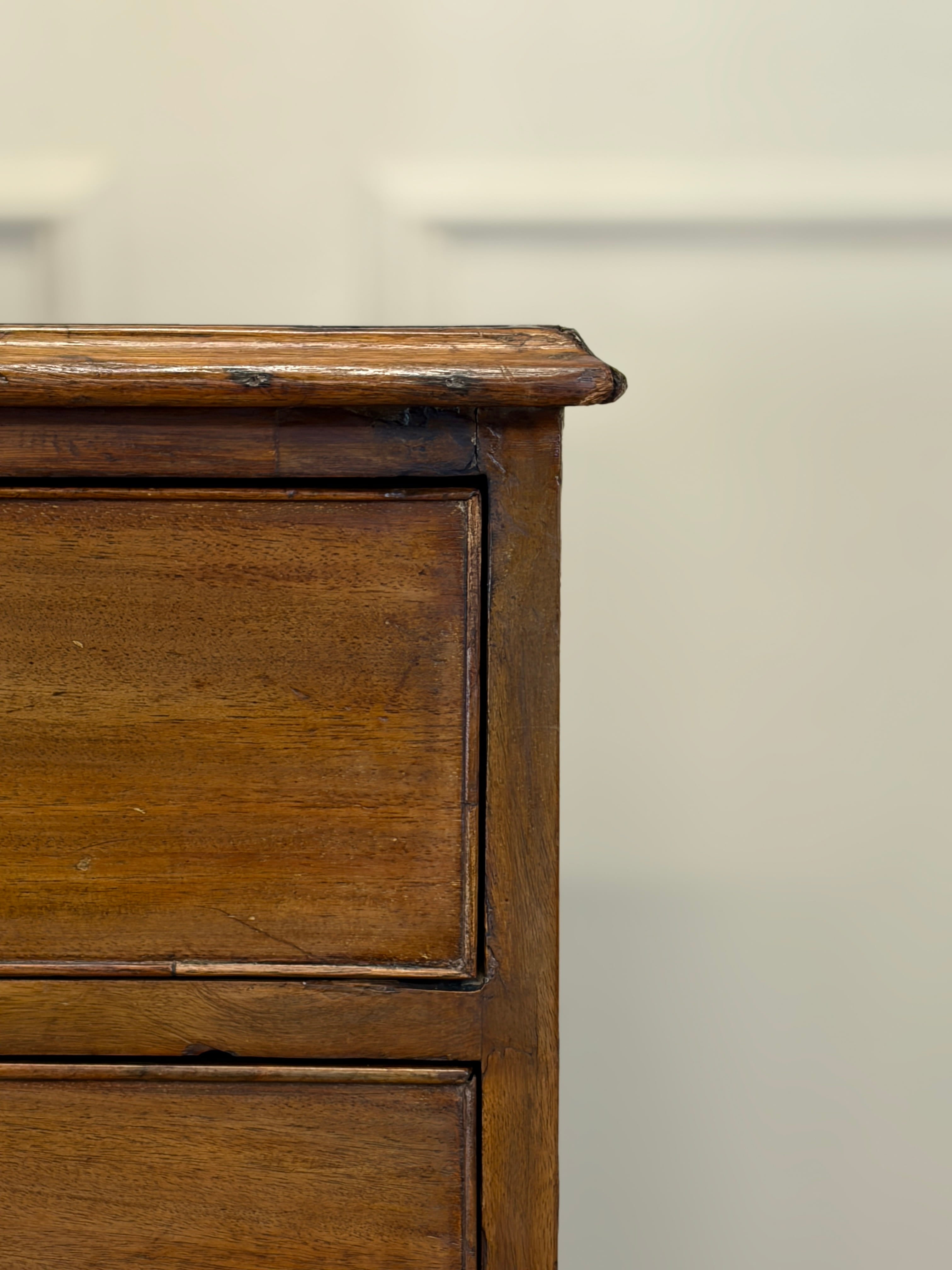 Close-up of a wooden drawer with a plain background