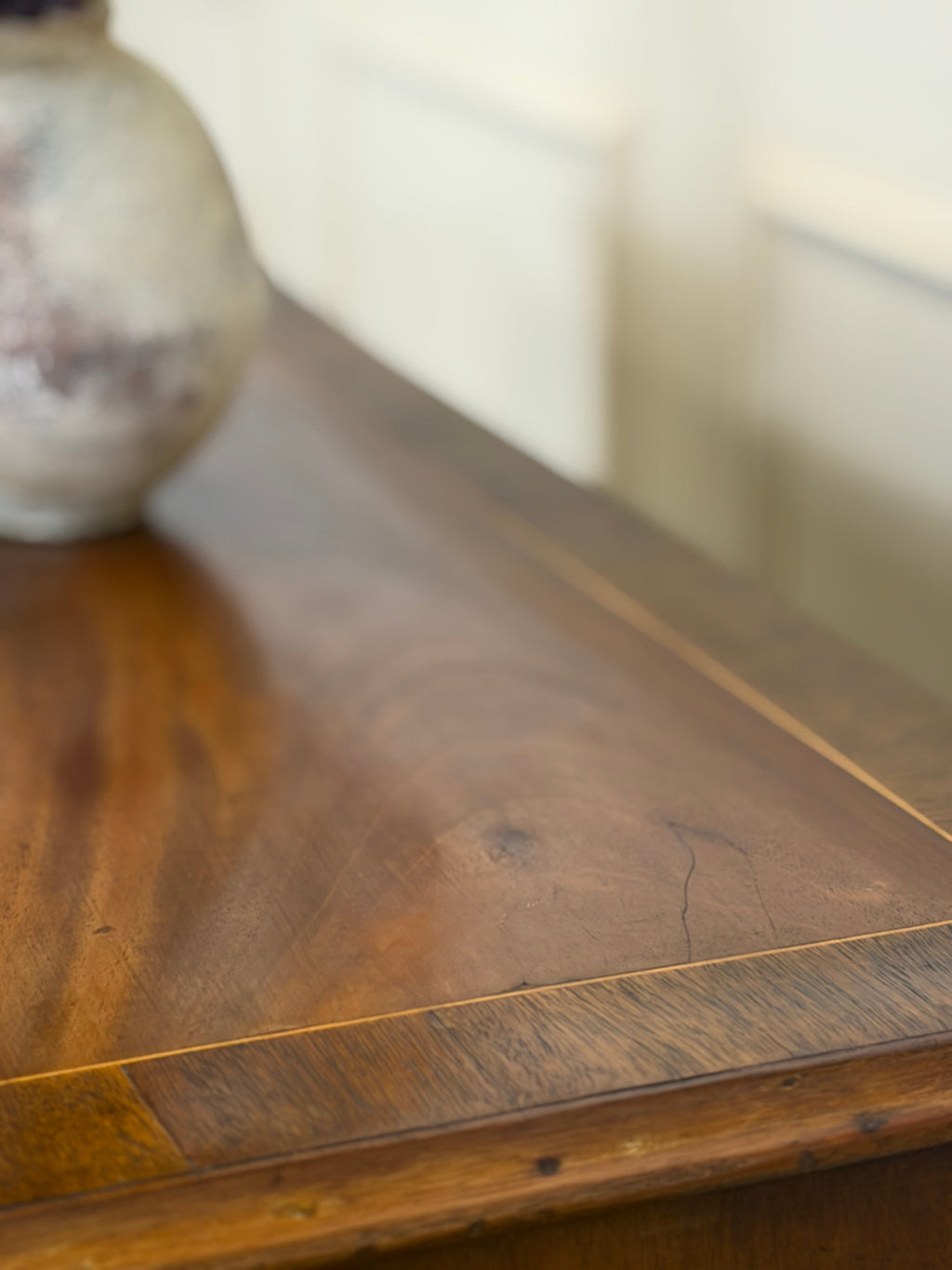 Close-up of a wooden surface with a blurred background