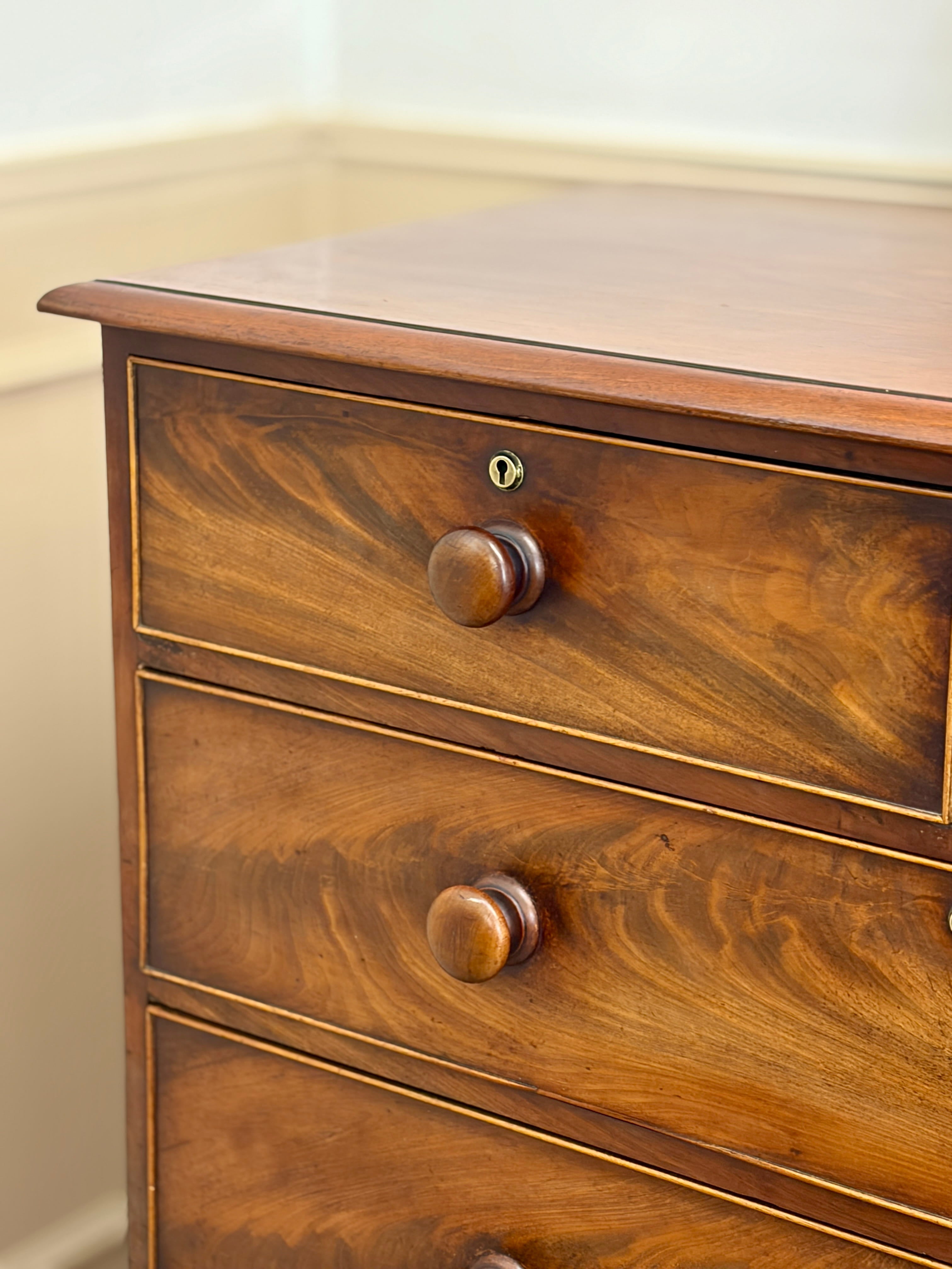 Wooden dresser with three drawers and visible grain pattern.