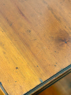 Close-up of a wooden surface with visible grain and texture