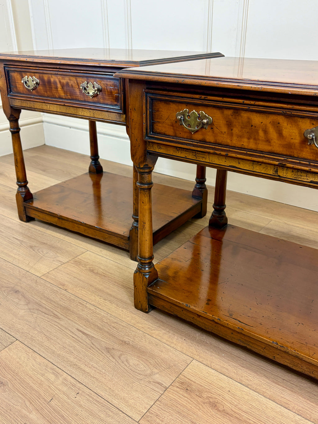 Wooden console table with drawers on a wooden floor
