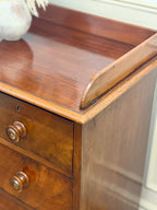 Wooden drawer with a smooth finish and visible grain pattern.
