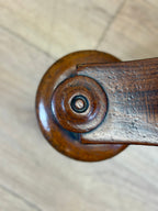 Close-up of a wooden handle on a door