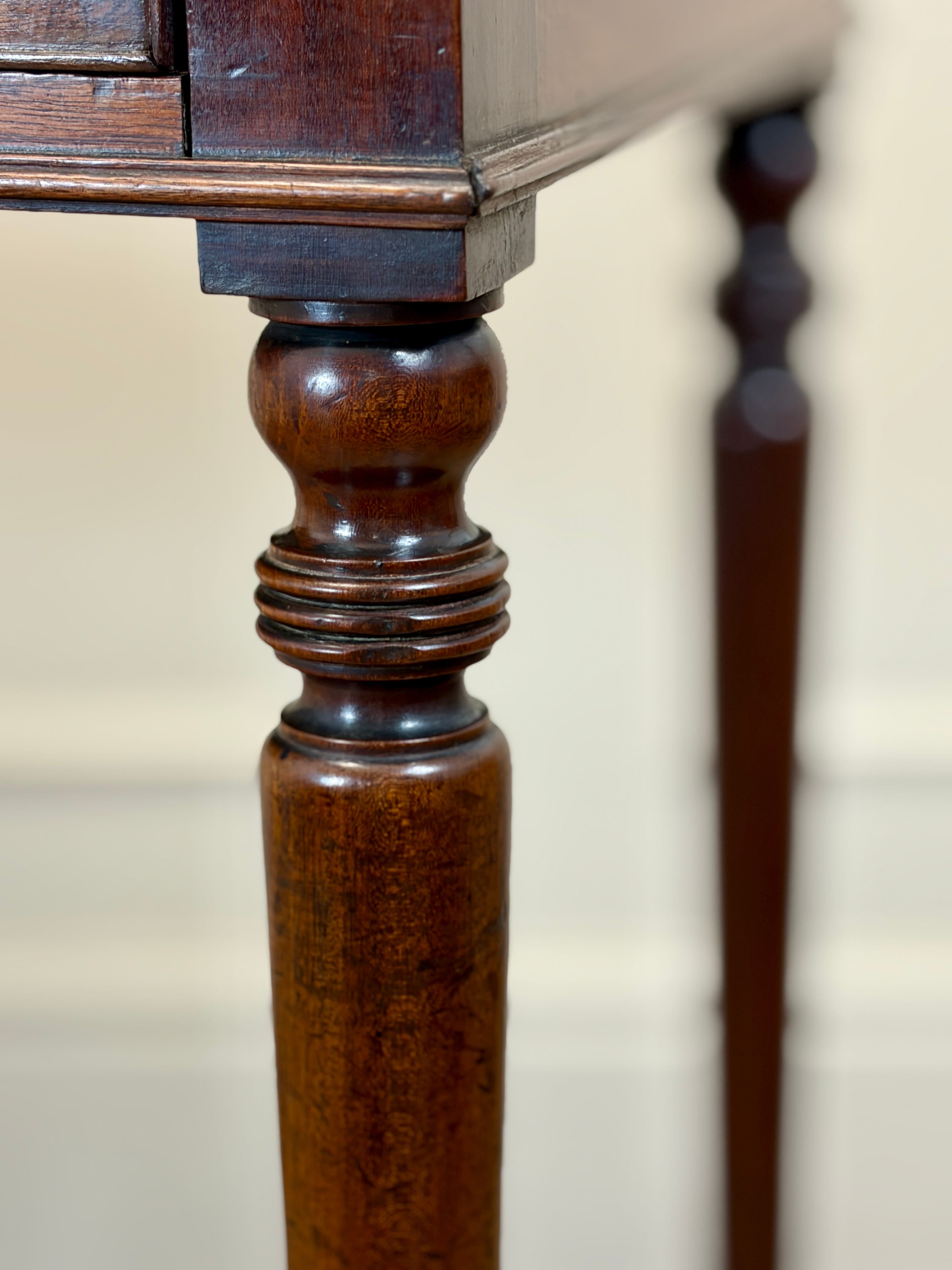 Close-up of a wooden leg with intricate detailing on a blurred background