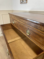 Angled view showing antique mahogany chest of drawers for bedroom with graduated drawers and Prince of Wales brasses