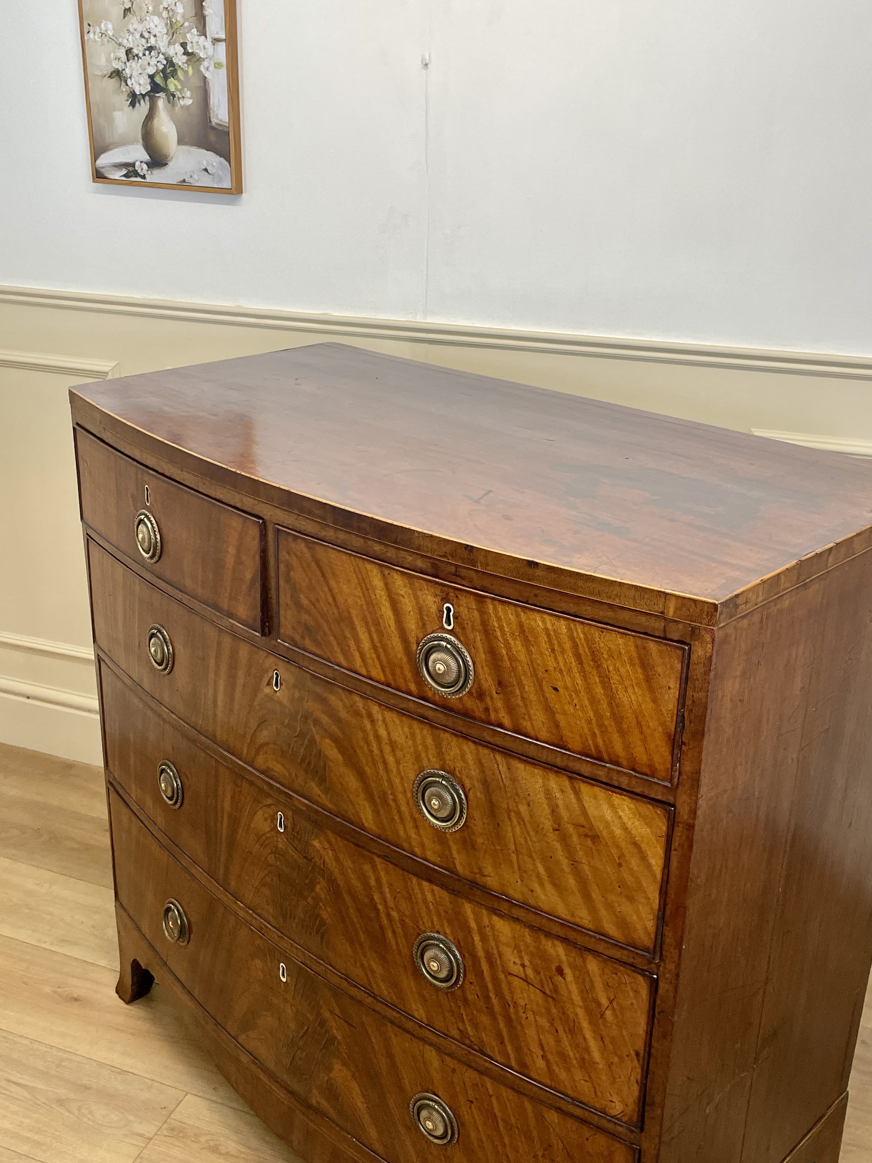 ntique Regency mahogany bowfront chest of drawers with two short over three long drawers, ideal chest of drawers for bedroom in a cottage interior.
