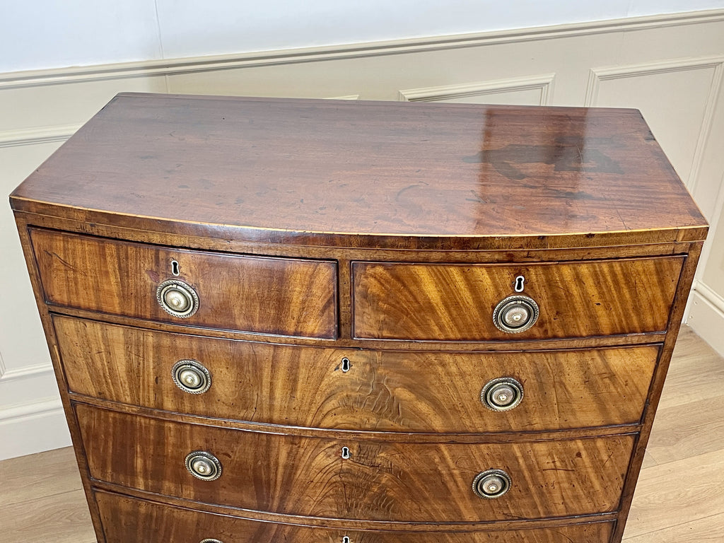 ntique Regency mahogany bowfront chest of drawers with two short over three long drawers, ideal chest of drawers for bedroom in a cottage interior.