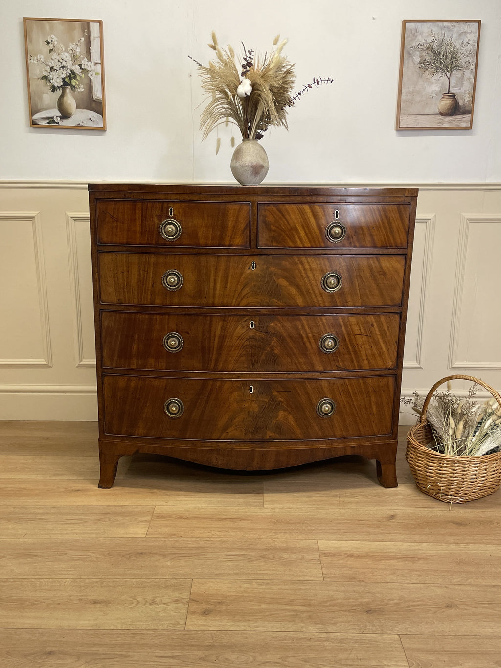 Front view of an antique Regency mahogany bowfront chest of drawers with two short over three long drawers, ideal chest of drawers for bedroom in a cottage interior.