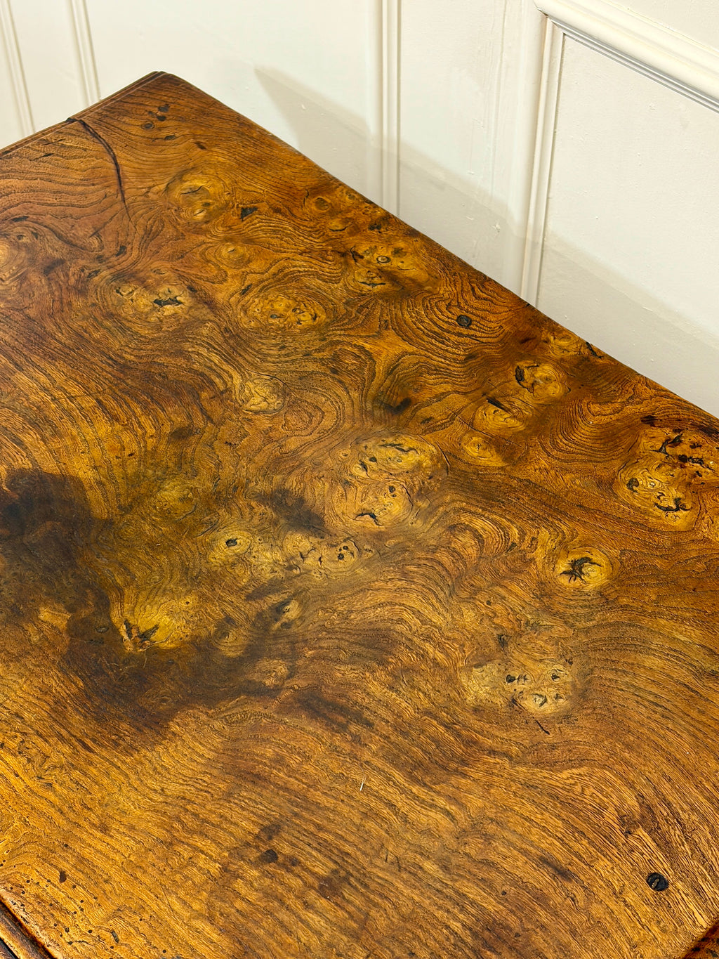 Close-up of a wooden surface with intricate grain patterns.