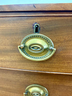 Wooden drawer with brass handles and keyhole