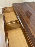 Angled view of late 19th century mahogany farmhouse chest of drawers with shaped bracket feet and elegant country furniture styling.