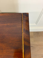 Close-up of a wooden surface with a visible grain pattern.