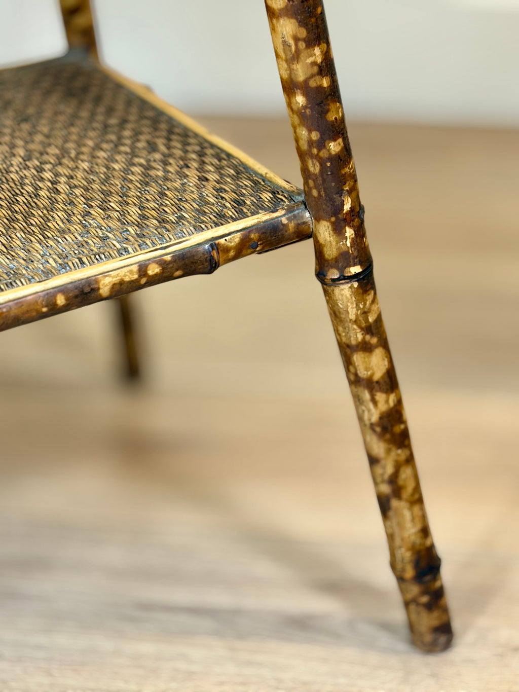Close-up of a rattan chair with a blurred background