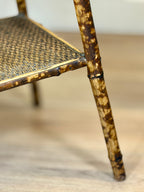 Close-up of a rattan chair with a blurred background
