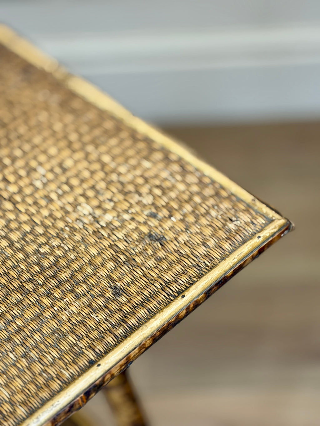 Close-up of a textured gold surface with a blurred background