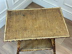 Wicker coffee table with a worn surface on a wooden floor.