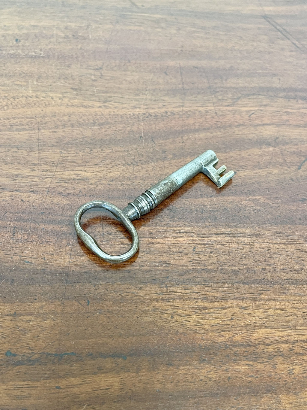 Vintage-style key on a wooden surface