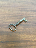 Vintage-style key on a wooden surface