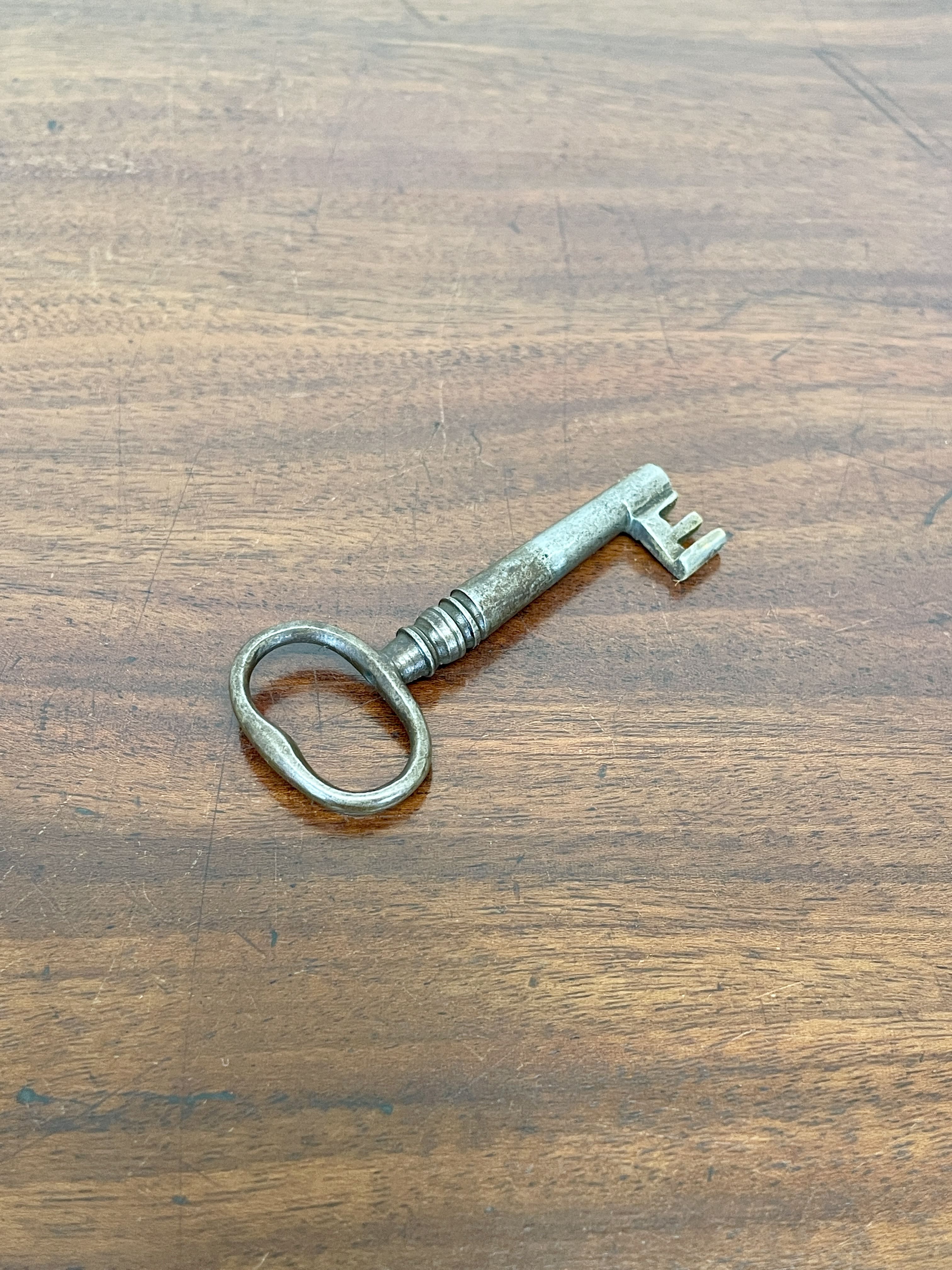 Vintage-style key on a wooden surface