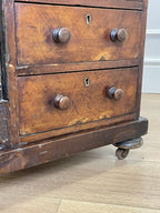 Antique Victorian Burr Walnut Davenport Writing Desk with original dark green leather top, boxwood stringing, side drawers, and turned columns on castors.