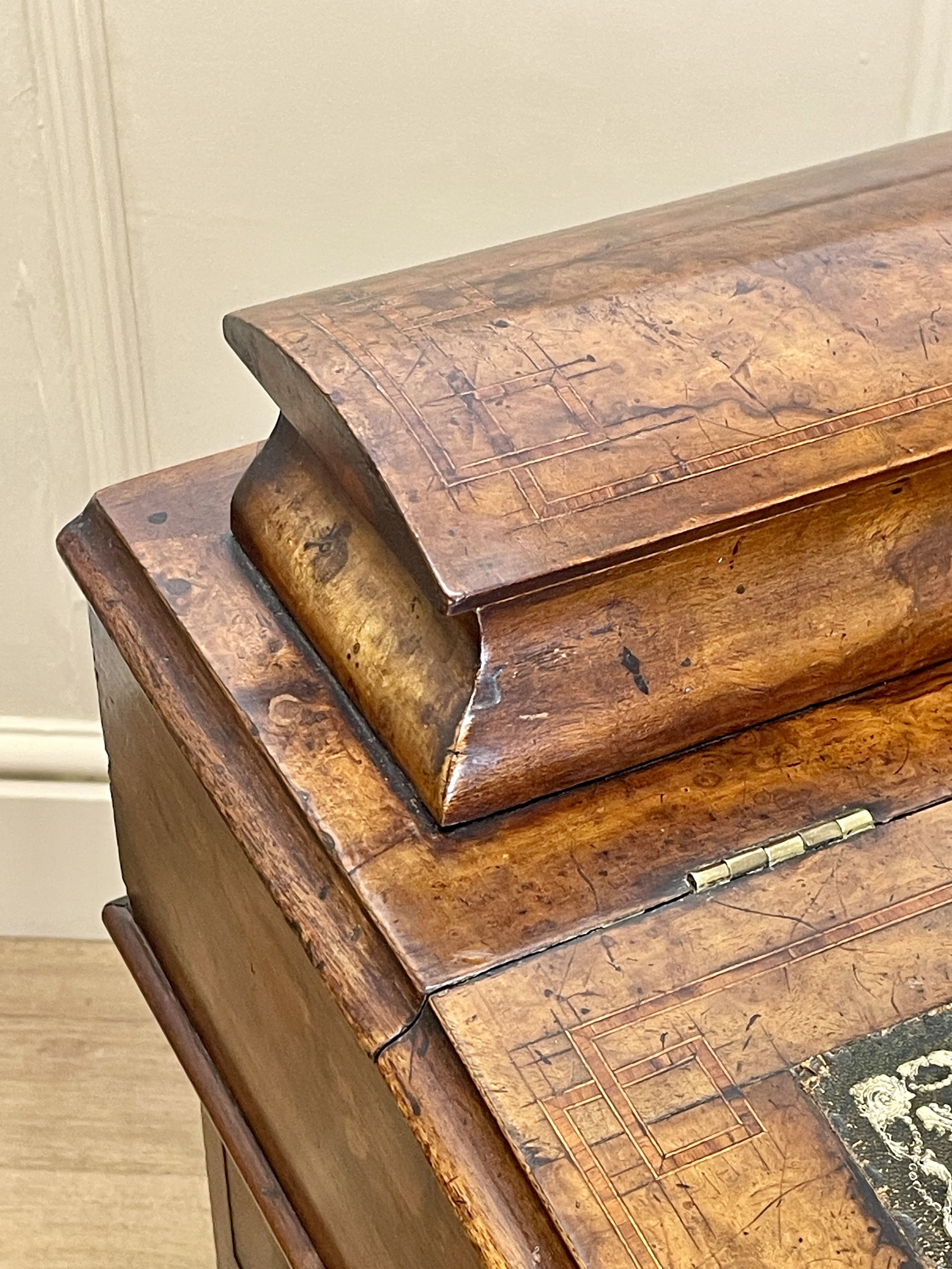 Antique Victorian Burr Walnut Davenport Writing Desk with original dark green leather top, boxwood stringing, side drawers, and turned columns on castors.