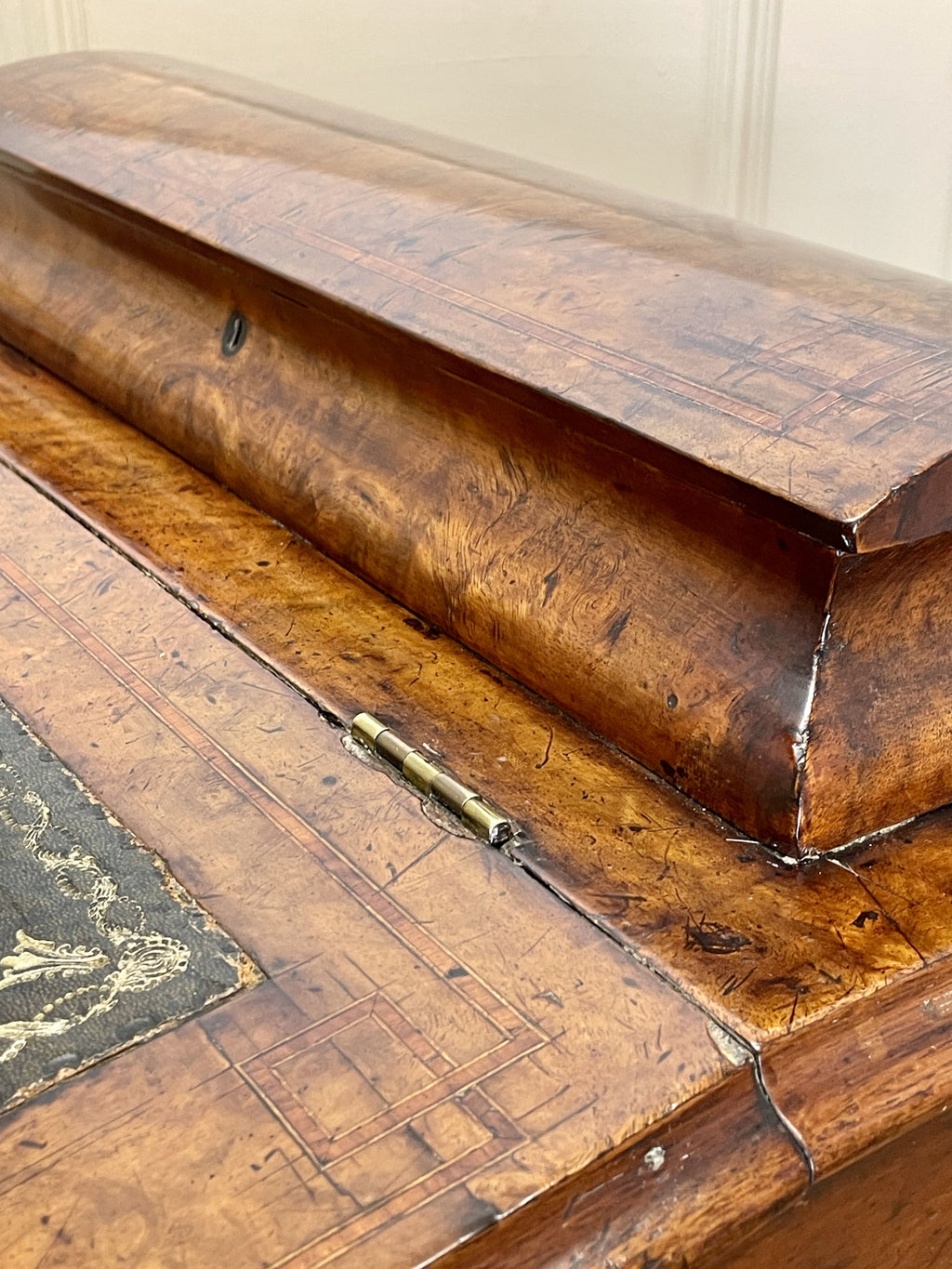 Antique Victorian Burr Walnut Davenport Writing Desk with original dark green leather top, boxwood stringing, side drawers, and turned columns on castors.
