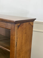 Wooden shelf with a plain white background