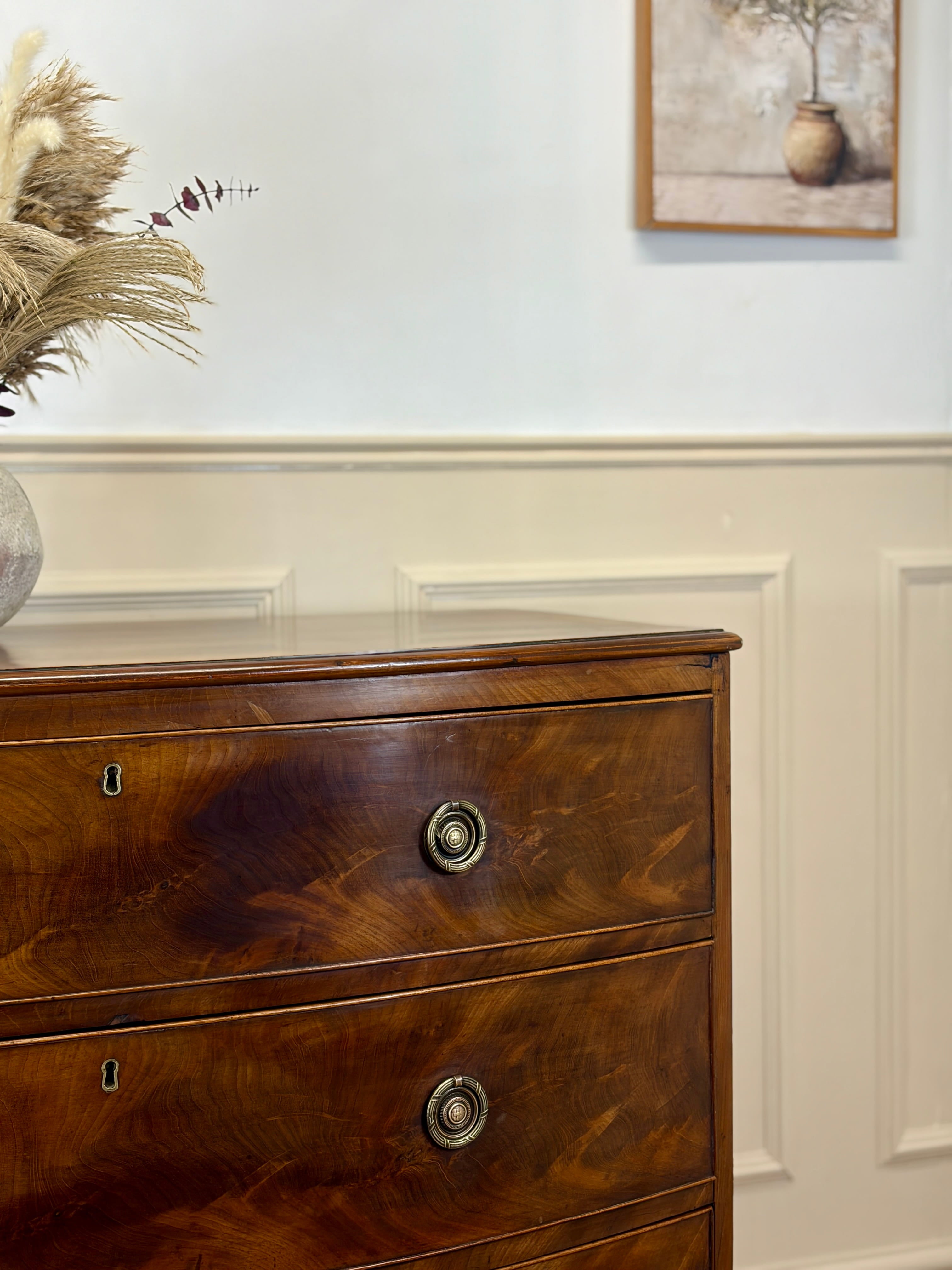 Wooden dresser with decorative elements in a room setting
