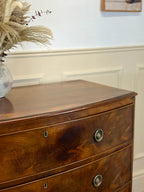 Wooden dresser with decorative elements on a wall
