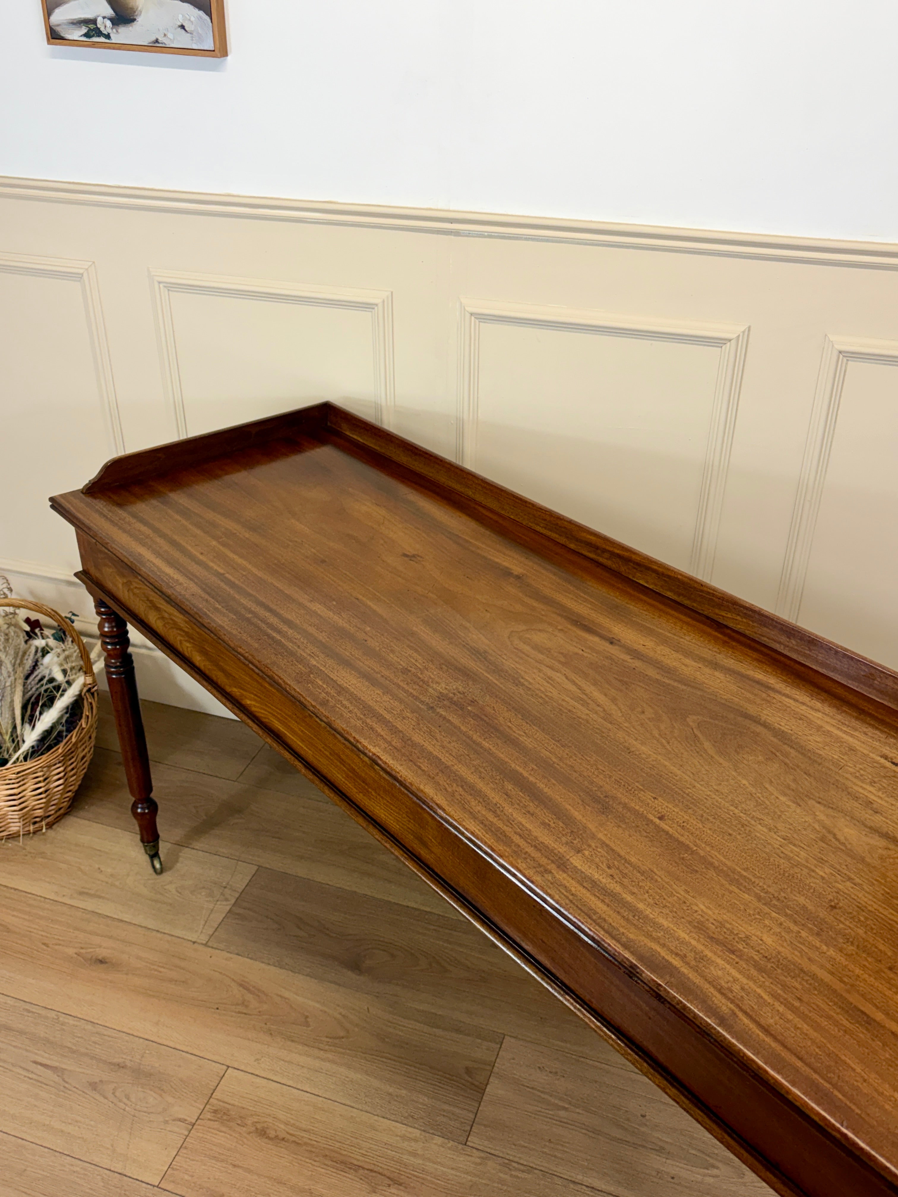Wooden tray on a wooden floor with a white wall in the background