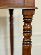 Close-up of a wooden table leg with intricate design