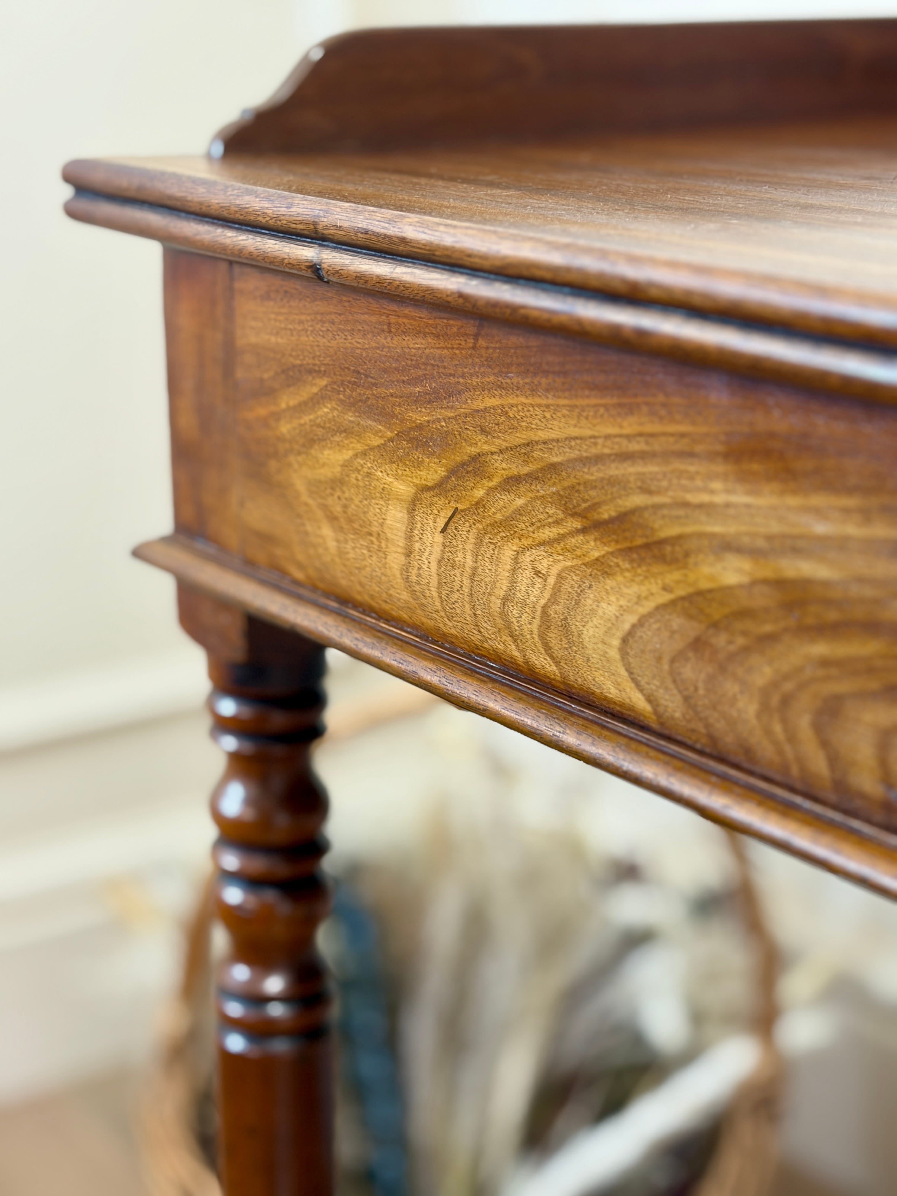 Close-up of a wooden sideboard with a blurred background