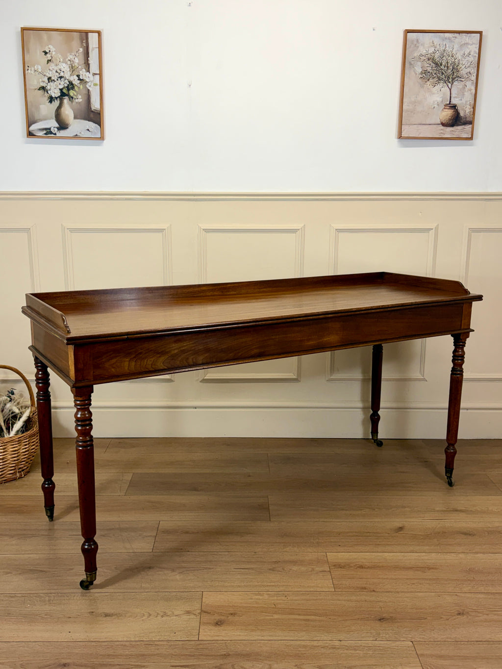 Wooden console table against a wall with decorative elements