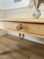 Wooden drawer with a knob on a wooden floor