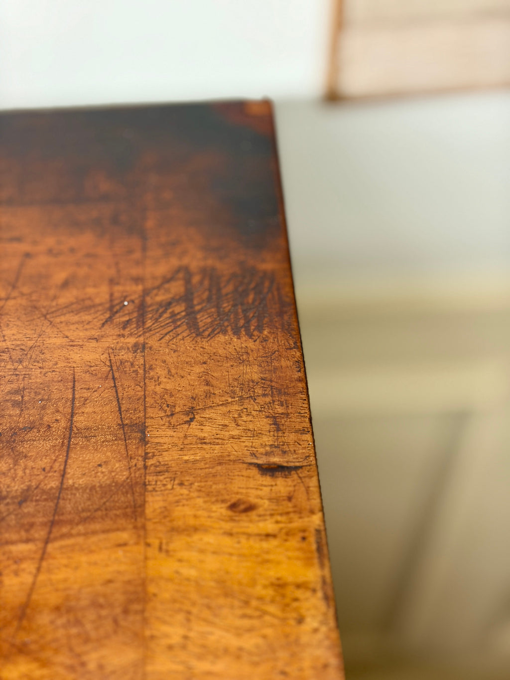 Close-up of a wooden surface with visible grain and texture.